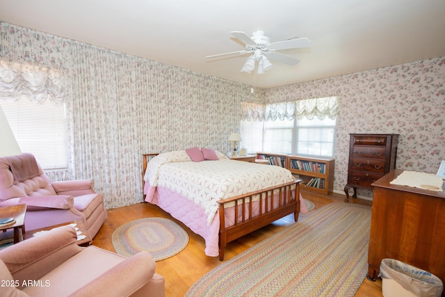 1565 E 12th St, Douglas, AZ 85607 - bedroom with wallpapered walls, wood finished floors, and a ceiling fan