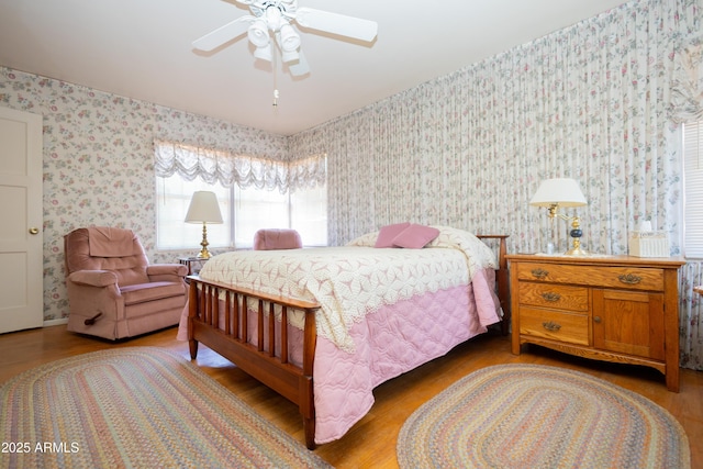 1565 E 12th St, Douglas, AZ 85607 - bedroom with wallpapered walls, light wood-type flooring, and a ceiling fan