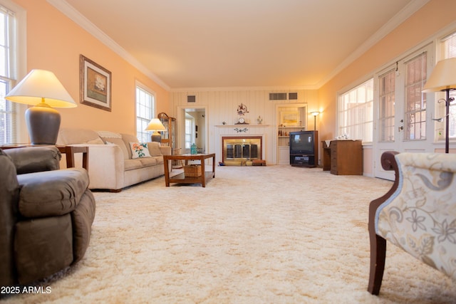 1565 E 12th St, Douglas, AZ 85607 - living room featuring crown molding, carpet flooring, and a glass covered fireplace