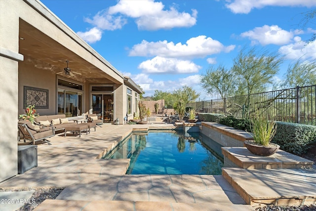 view of swimming pool featuring a patio area, outdoor lounge area, and ceiling fan