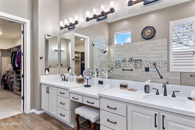 bathroom with vanity and walk in shower