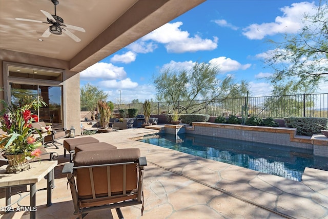 view of swimming pool with a patio and ceiling fan