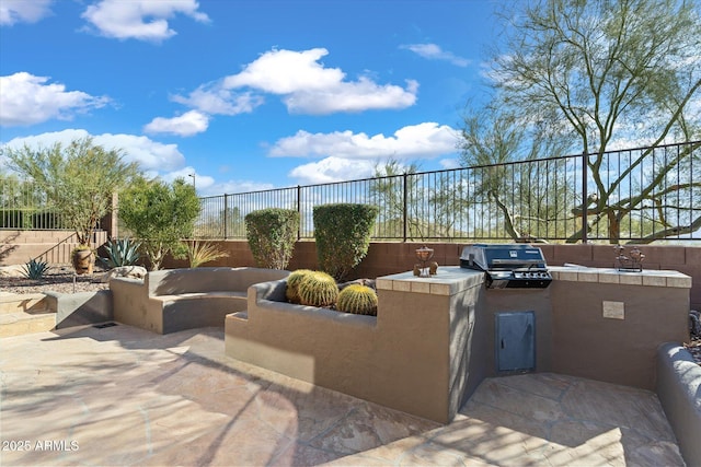 view of patio / terrace with a grill and exterior kitchen