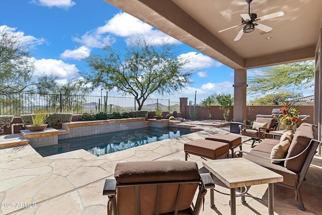 view of swimming pool featuring ceiling fan and a patio area