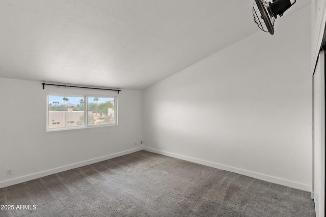 5621 N 79th St, Scottsdale, AZ 85250 - carpeted empty room with lofted ceiling and baseboards