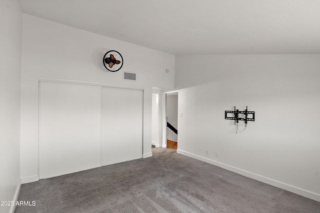 5621 N 79th St, Scottsdale, AZ 85250 - unfurnished bedroom with vaulted ceiling, carpet floors, baseboards, and a closet