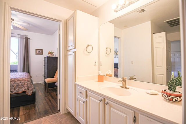 ensuite bathroom featuring vanity, ensuite bathroom, and visible vents