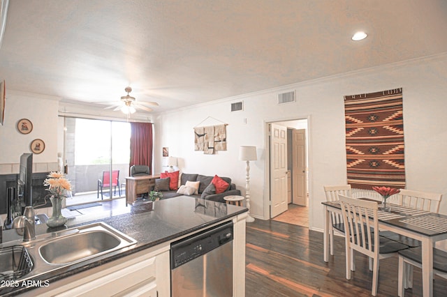 kitchen featuring dishwasher, visible vents, crown molding, and ceiling fan