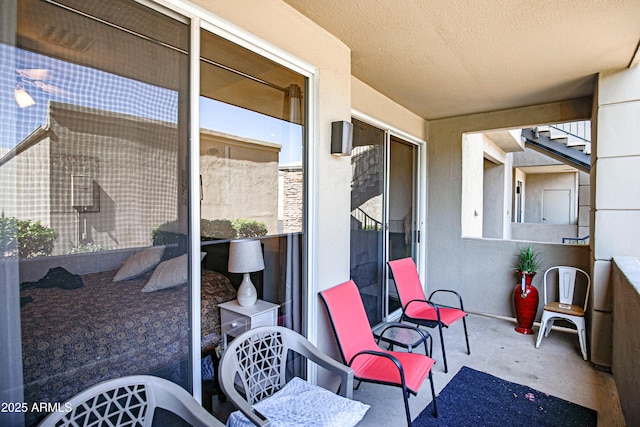 view of patio with a balcony