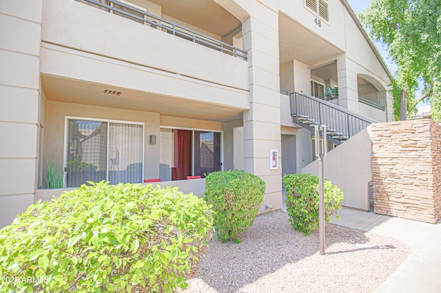 property entrance featuring stucco siding