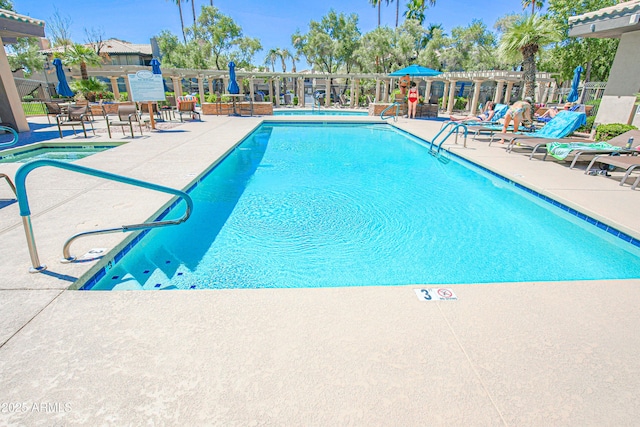 community pool featuring a patio area