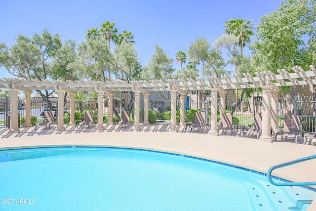 pool featuring a patio, a pergola, and fence