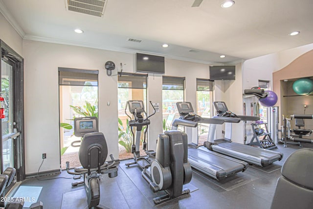 exercise room featuring crown molding, visible vents, and recessed lighting
