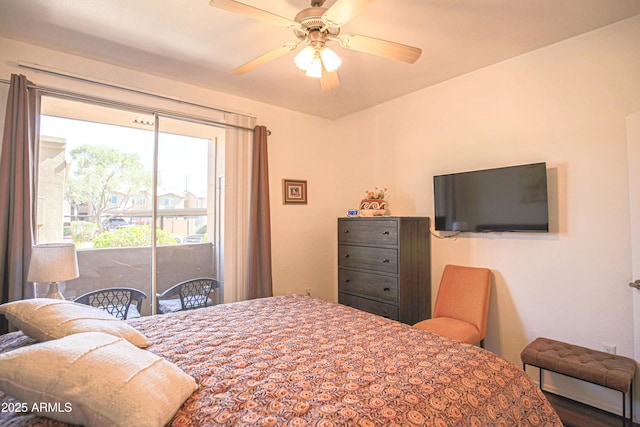 bedroom featuring access to outside and a ceiling fan