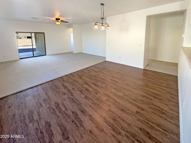 empty room with dark wood-type flooring and ceiling fan