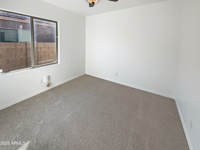 unfurnished room with carpet flooring and ceiling fan