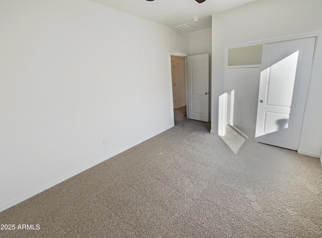 unfurnished bedroom with carpet floors and ceiling fan