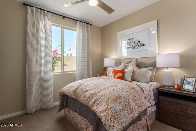 bedroom featuring baseboards, carpet flooring, and a ceiling fan