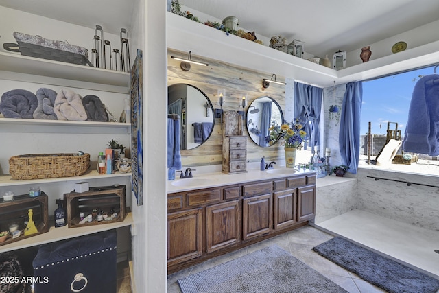 full bathroom with tile patterned flooring, a sink, and double vanity