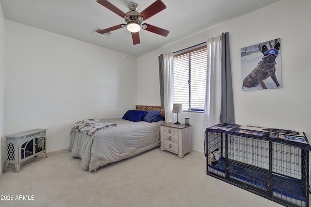 bedroom with carpet floors, visible vents, and a ceiling fan