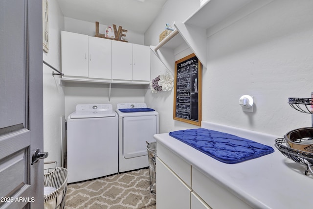 laundry room featuring washer and dryer and cabinet space