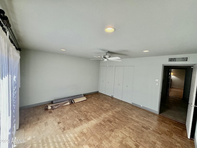 unfurnished bedroom with recessed lighting, a ceiling fan, visible vents, and baseboards