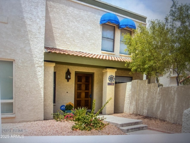 8653 S 51st St Unit 2, Phoenix, AZ 85044 - view of front of property with stucco siding and a tiled roof