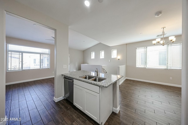 kitchen featuring a sink, plenty of natural light, white cabinetry, dishwasher, and wood tiled floor