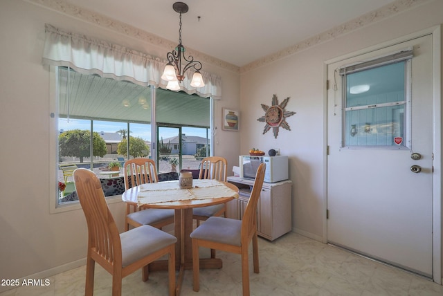 dining area with a chandelier