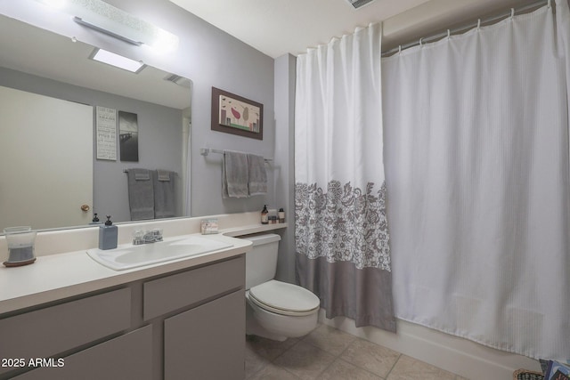 full bathroom featuring tile patterned flooring, vanity, shower / bath combination with curtain, and toilet