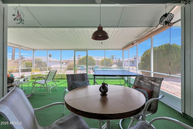 sunroom featuring a mountain view