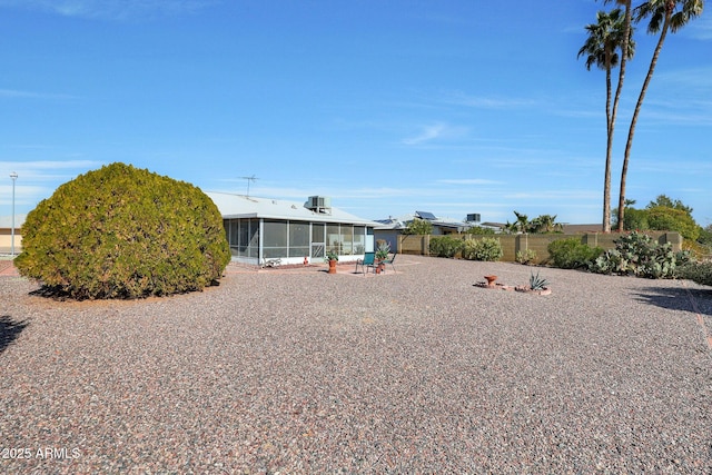 rear view of house with a sunroom