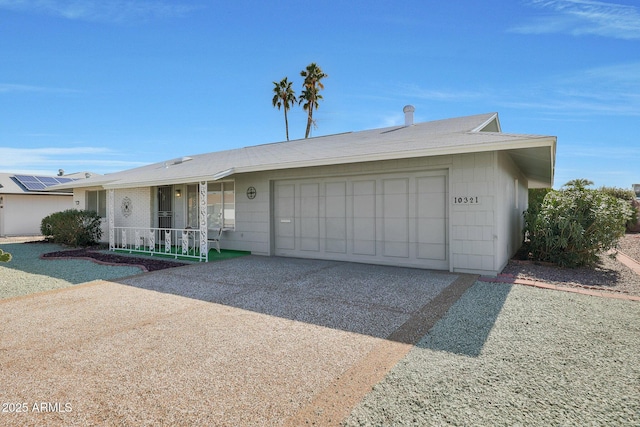 ranch-style home with a garage