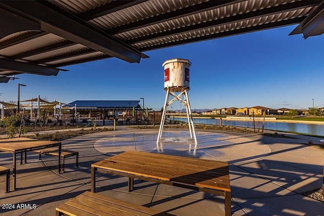 view of patio featuring a water view