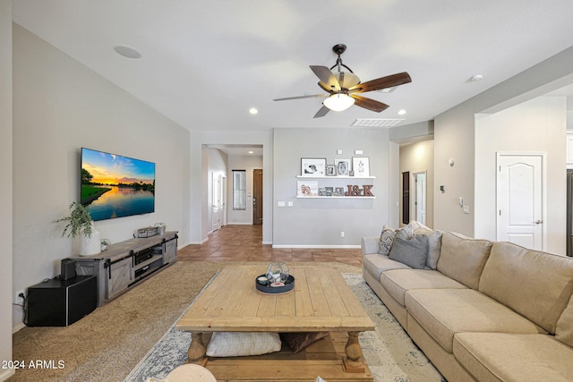 tiled living room with ceiling fan