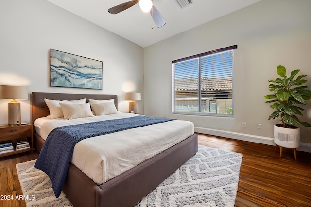 bedroom featuring vaulted ceiling, ceiling fan, and dark hardwood / wood-style flooring