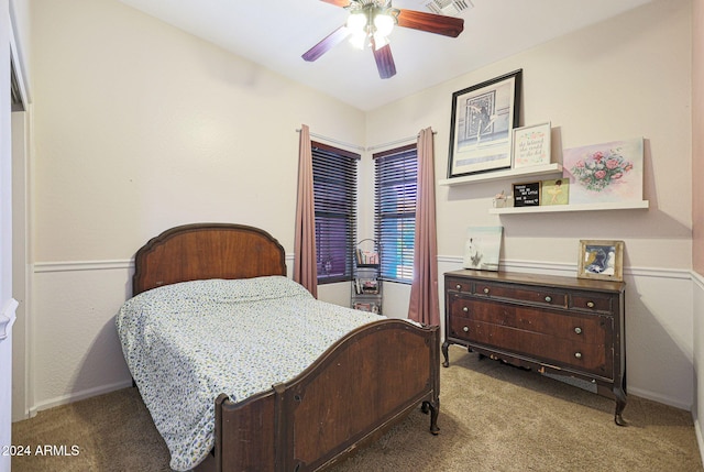 bedroom featuring ceiling fan and carpet