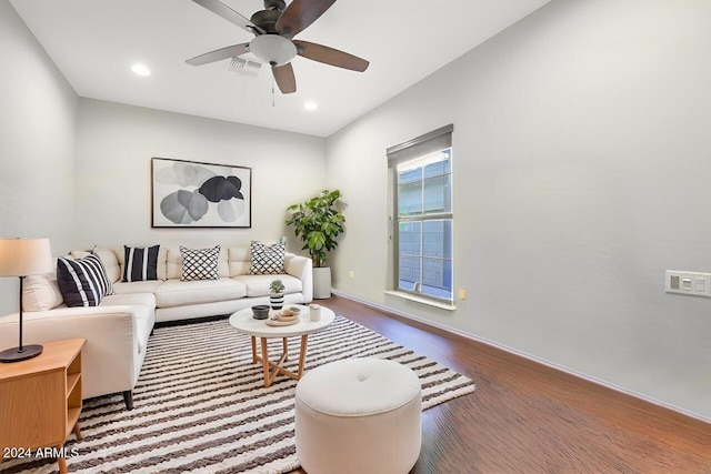 living room featuring ceiling fan and hardwood / wood-style floors