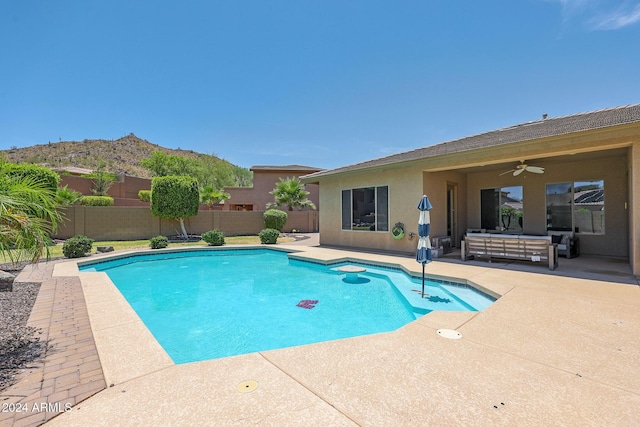 view of swimming pool with a patio and ceiling fan