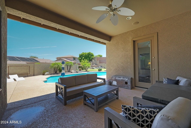 view of patio / terrace with ceiling fan, a fenced in pool, and an outdoor living space