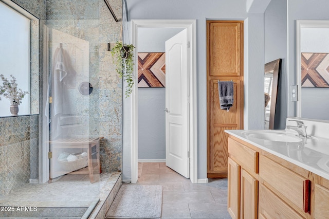 bathroom featuring vanity, a walk in shower, and tile patterned floors