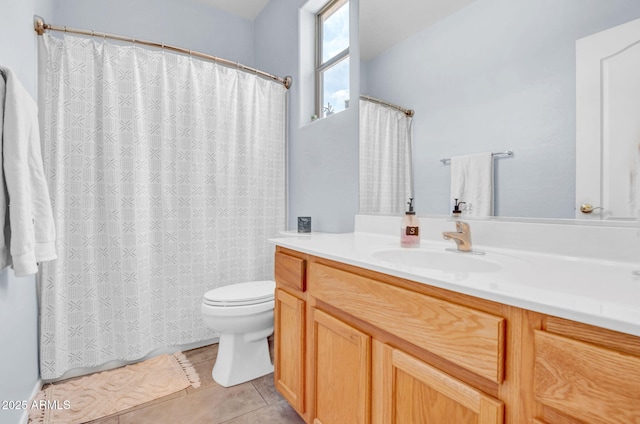 full bath featuring vanity, tile patterned flooring, toilet, and curtained shower