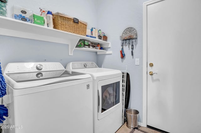 laundry room featuring laundry area and washer and clothes dryer