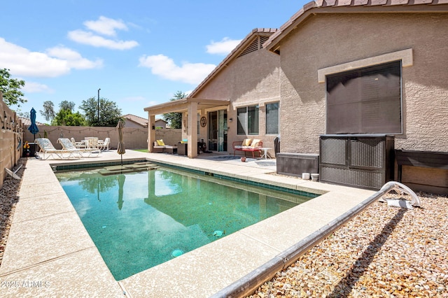 view of pool with a fenced backyard, a fenced in pool, and a patio area