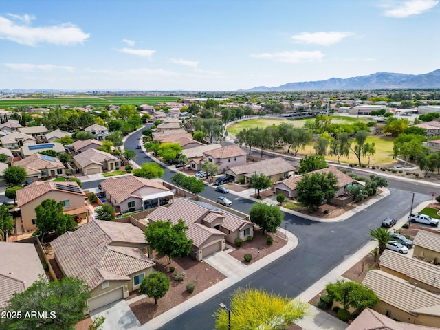 drone / aerial view featuring a residential view and a mountain view