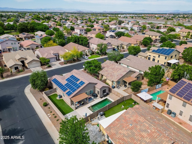 birds eye view of property with a residential view