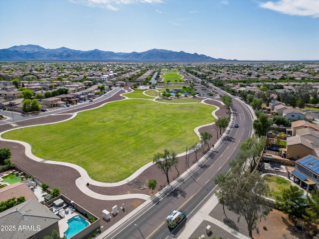 birds eye view of property with a mountain view and a residential view