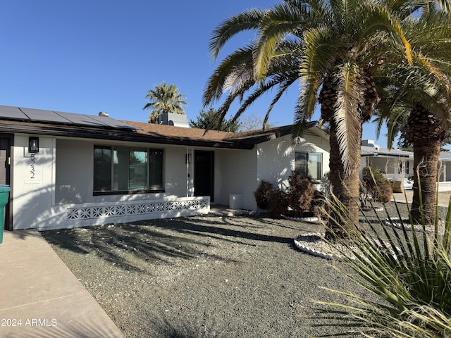 view of front of house with solar panels