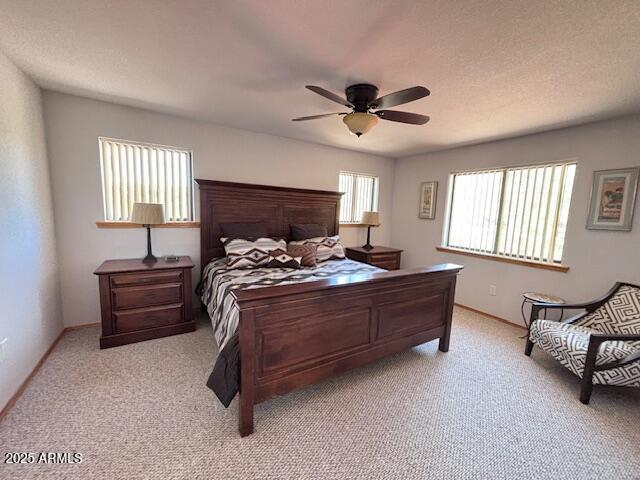 2806 Skyhawk Dr, Overgaard, AZ 85933 - bedroom with light carpet, a ceiling fan, and baseboards