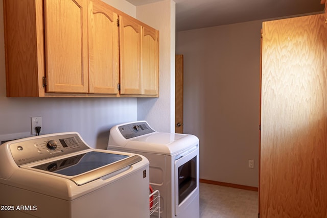 2806 Skyhawk Dr, Overgaard, AZ 85933 - clothes washing area with washer and clothes dryer, cabinet space, tile patterned floors, and baseboards